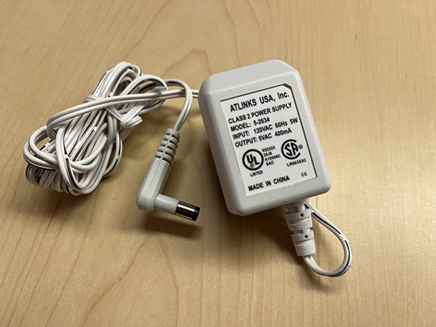A photo graph of two plug in transformers operated on voltages other than common one hundred twenty volt AC.