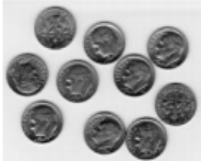Ten United States dime coins in a loose cluster, illustrating that ten dimes make one dollar as a memory aid for deciles dividing data into ten equal parts.