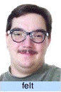 Photograph of the same stimulus person captioned "felt": a broad closed-mouth smile with the cheeks raised and the eyes crinkled — the felt-smile condition.