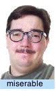 Photograph of the same stimulus person captioned "miserable": a small, tight, slightly lopsided smile with a strained expression — the miserable-smile condition.