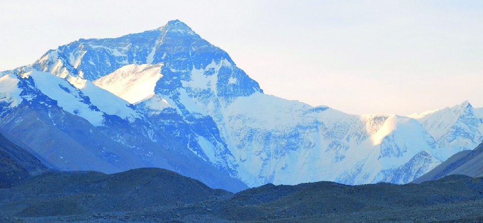 Photo shows a snow-covered mountain range.