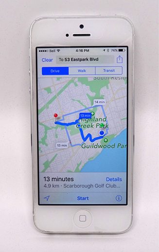 A photograph of an Apple iPhone showing directions on a map.