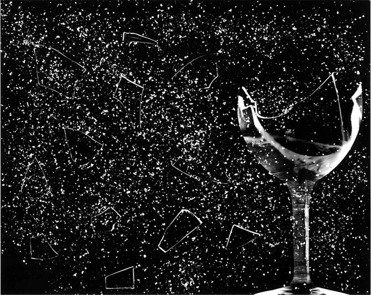 Picture shows a photograph of a wine glass shattering into many little pieces.