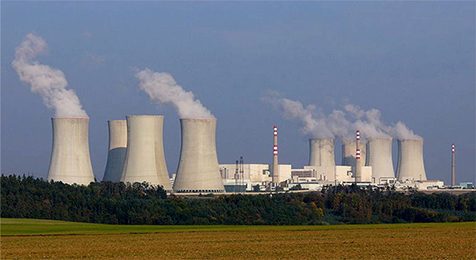 The photo shows gases releasing from a power plant.
