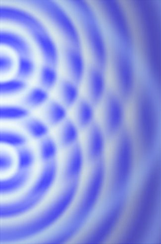 A photograph of an interference pattern is shown. Waves visible as white circles on the blue surface emanate from two centers and intersect at the numerous points.